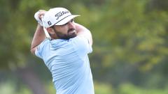 French golfer Antoine Rozner takes a shot